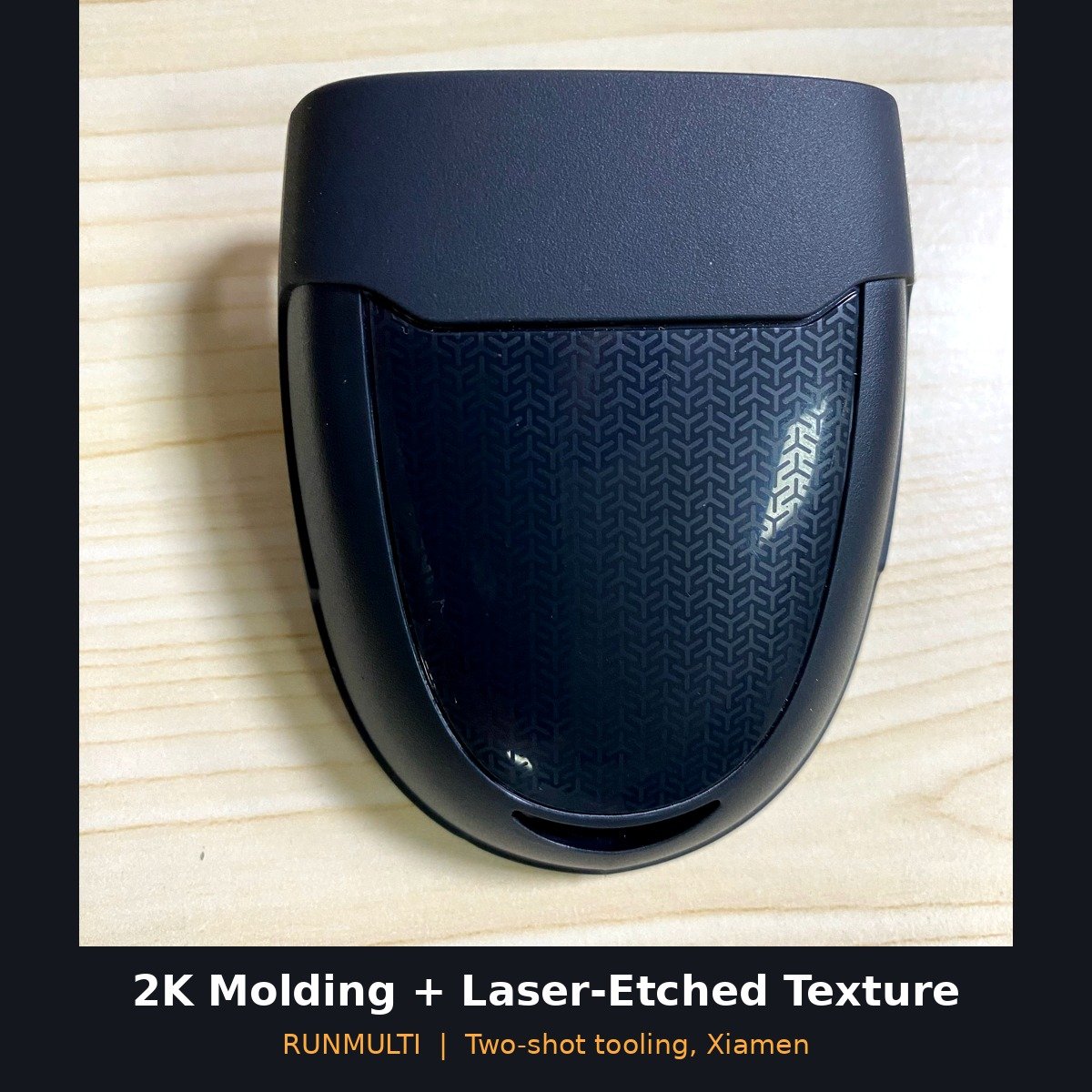 Two-shot molded housing with laser-etched texture window